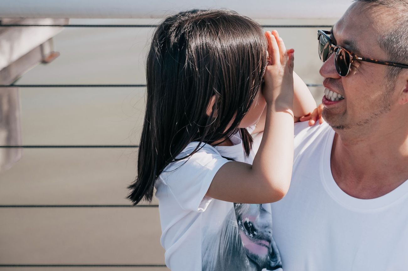 A father celebrating with his young daughter