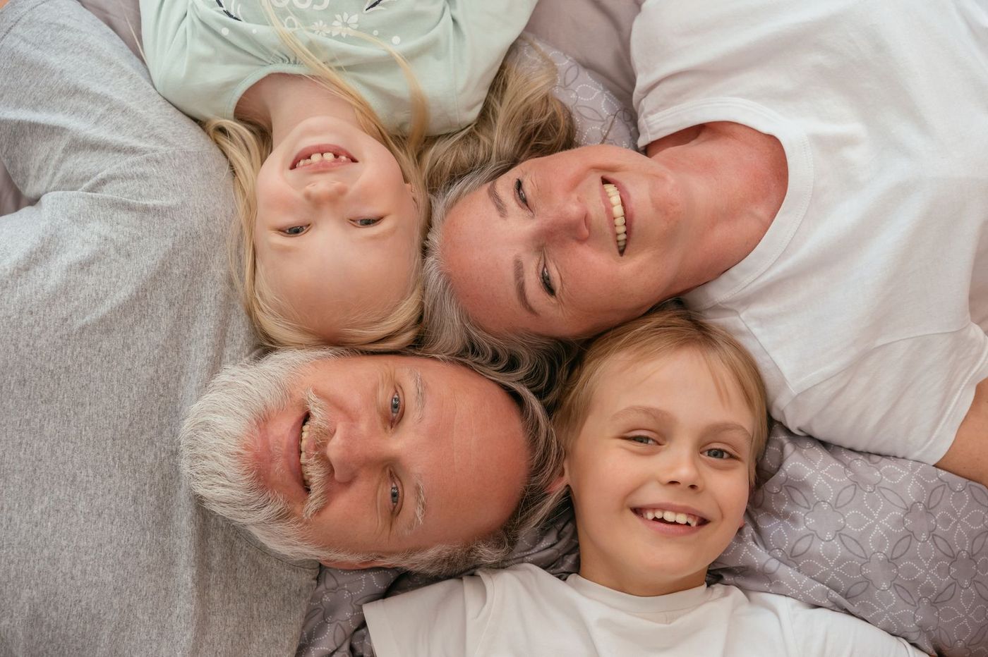 Three generations of a happy family smiling together