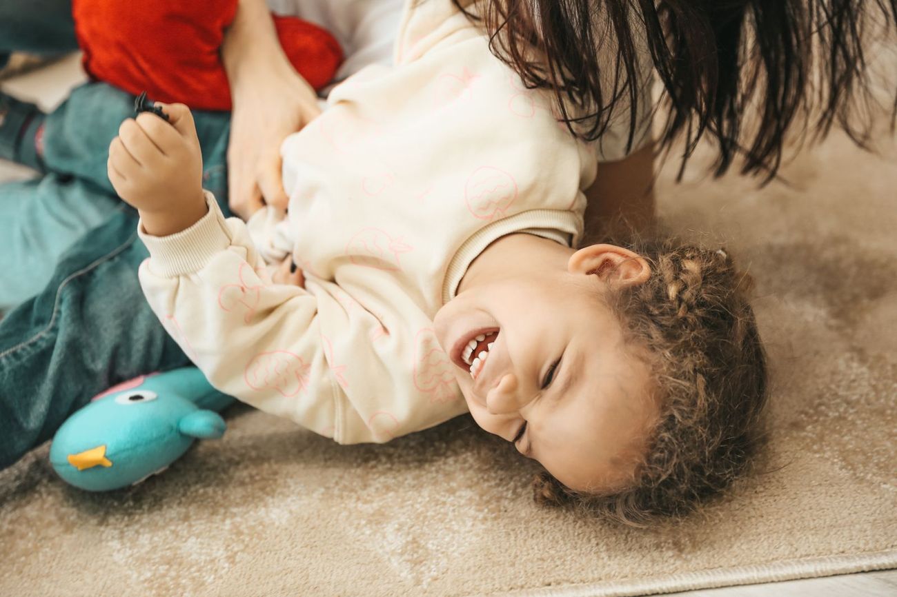 A child laughing joyfully at home