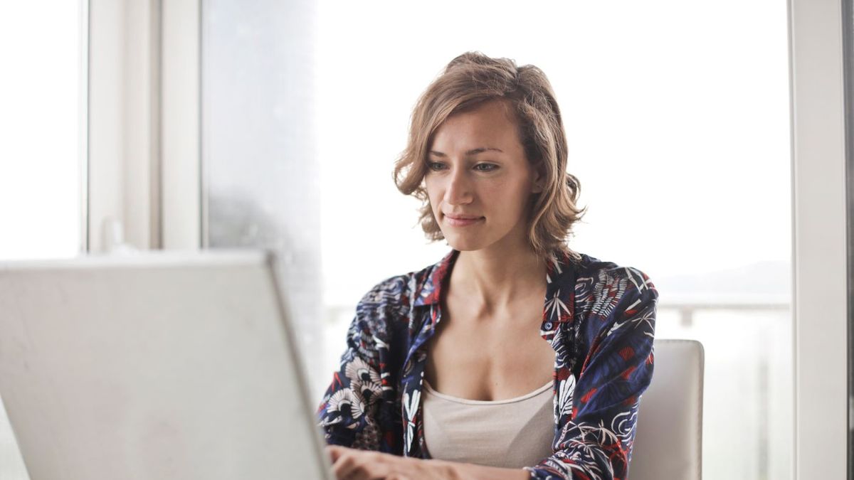 An agent working on a laptop